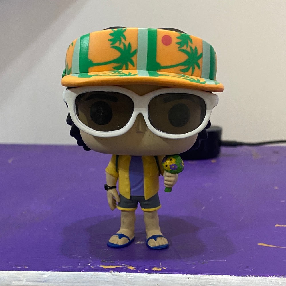 Funko Pop Figure with Orange and Green Tropical Hat